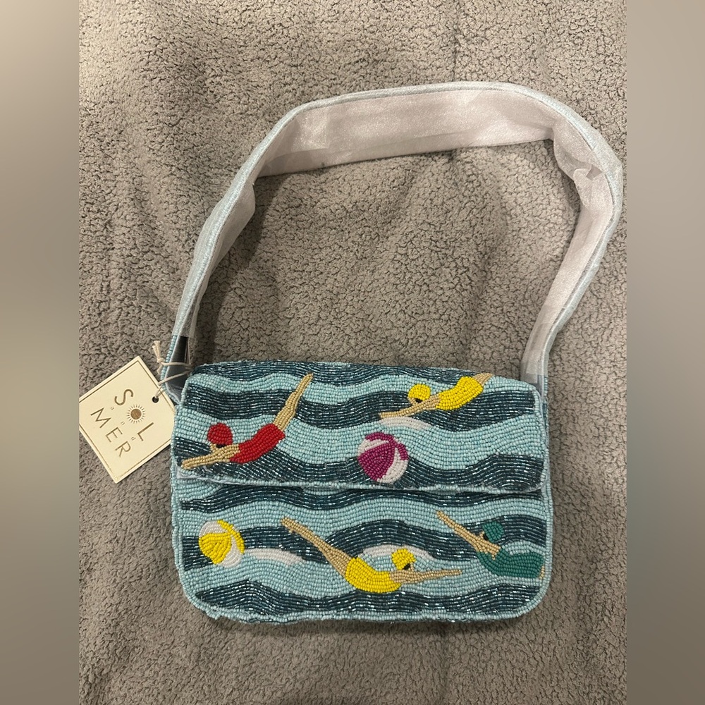 Sol and Mer swimmers beaded bag